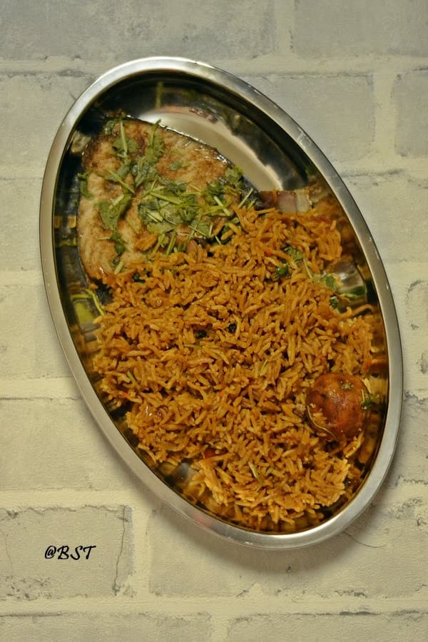 Machboos kanaad - spiced fish and rice.